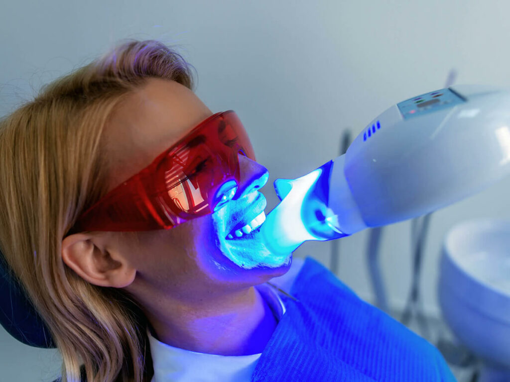 girl getting her teeth whitening