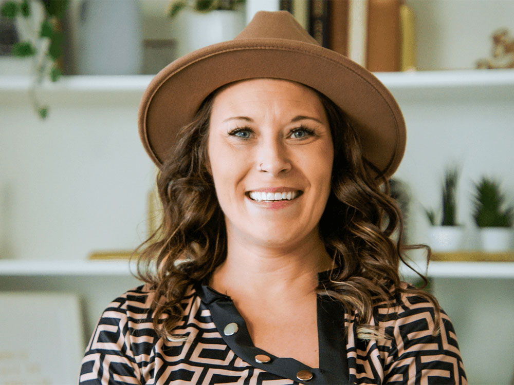 smiling female patient of Barrhaven with hat